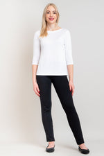 Women's white short bodice 3/4 sleeve sweater shirt with tapered black pants.
