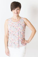 Women's pink rose floral print sleeveless muscle tank top with wide shoulder straps and scoop neck, made from natural bamboo fibers.