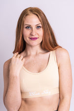 Women's beige workout bra made with all sustainable and natural fibers for ideal comfort and support.