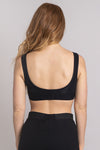 Women's black workout bra made with all sustainable and natural fibers for ideal comfort and support.