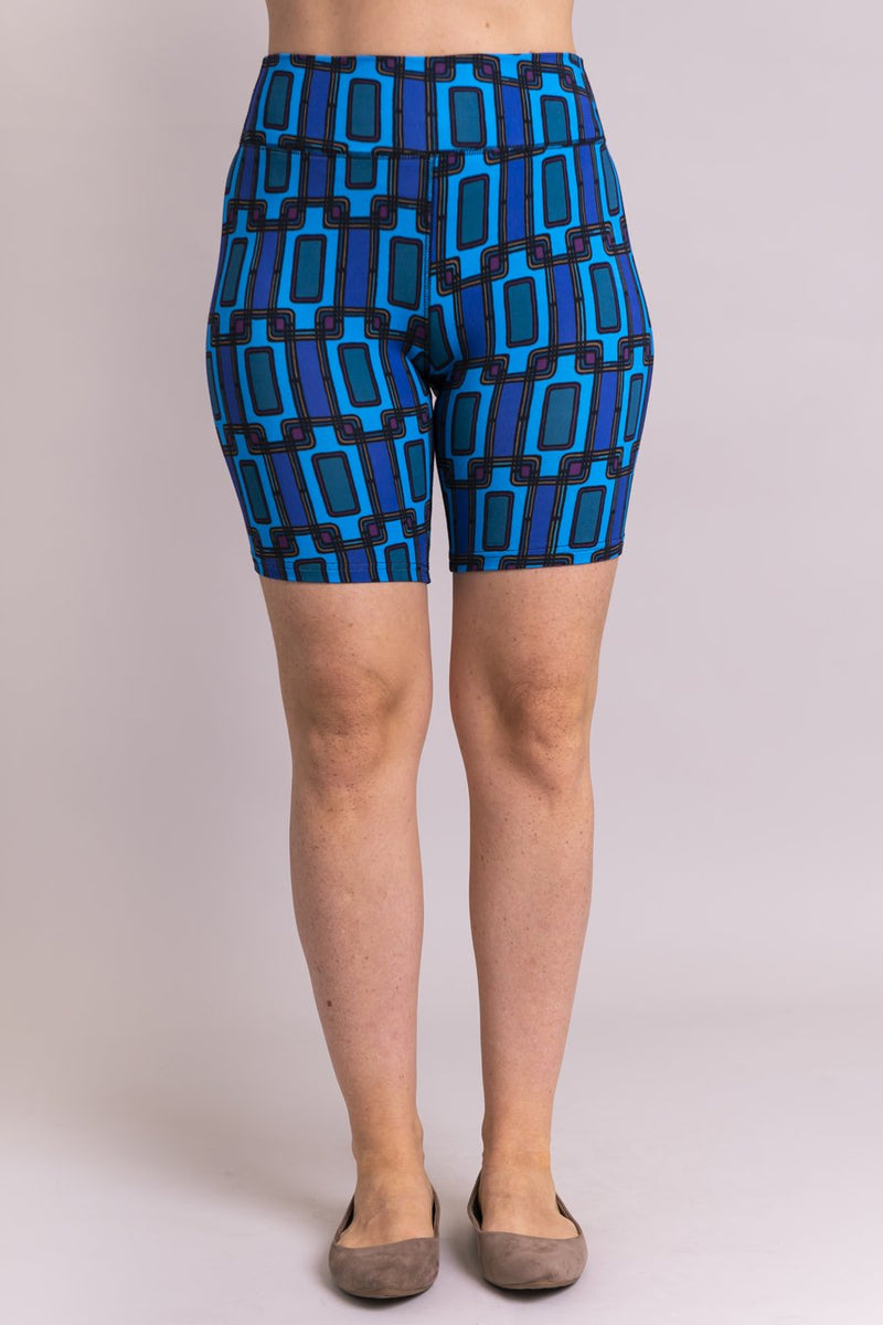 Women's blue Fairlane print biker shorts for yoga, workout, or casual wear. Made with comfortable, stretchy, and sustainable natural fibers.