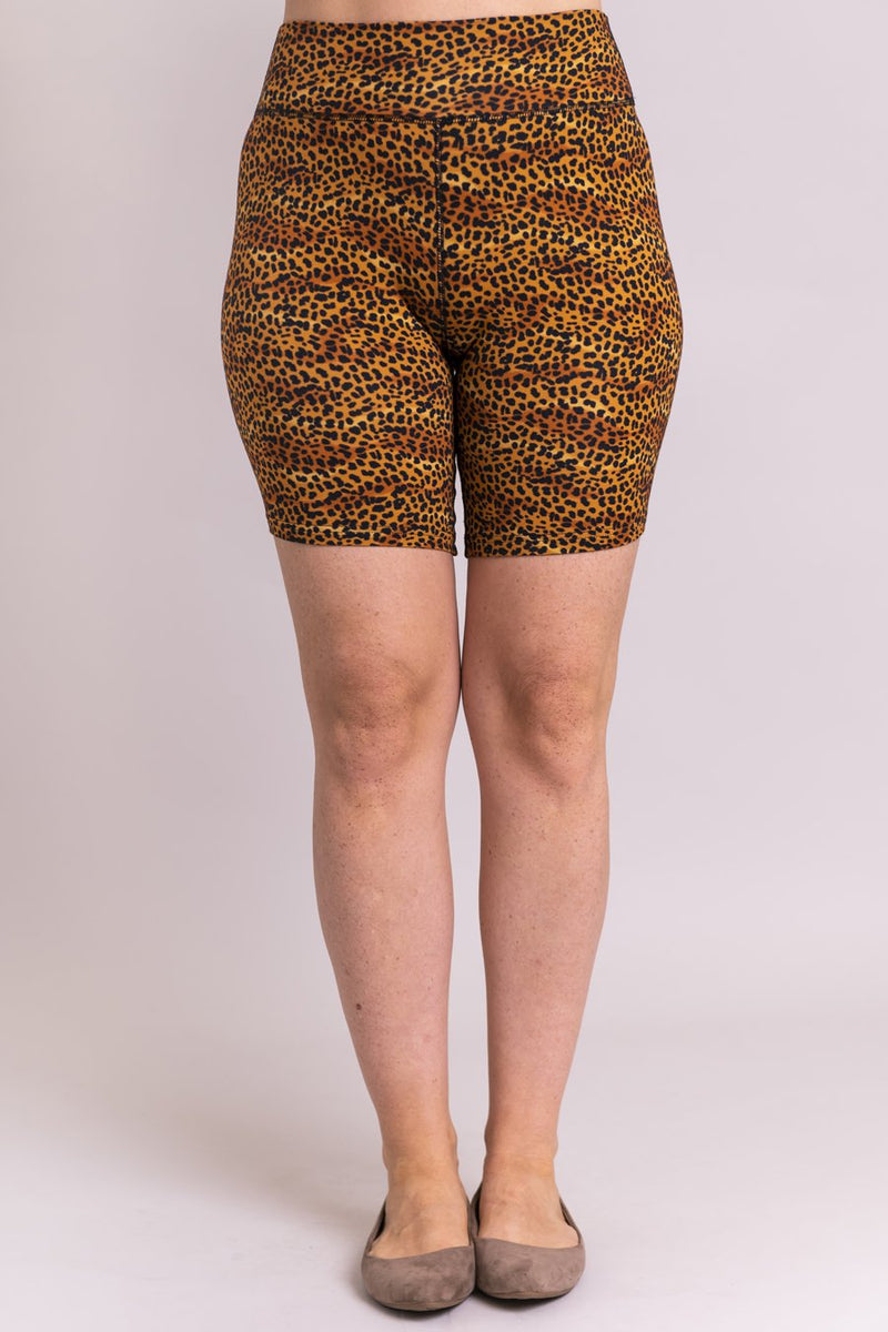 Women's gold cheetah print biker shorts for yoga, workout, or casual wear. Made with comfortable, stretchy, and sustainable natural fibers.
