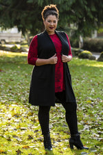 Women's plus size black long sleeveless vest sweater with pockets, made out of natural bamboo fibers.