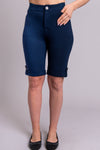 Women's indigo blue knee-length stretchy shorts with pockets and buttons, made with natural bamboo fibers.