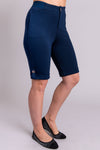 Women's indigo blue knee-length stretchy shorts with pockets and buttons, made with natural bamboo fibers.