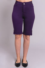 Women's purple knee-length stretchy shorts with pockets and buttons, made with natural bamboo fibers.