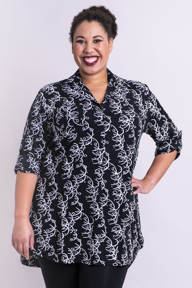 Women's black batik art 3/4 sleeve V-neck blouse tunic with small collar, pockets, and round hemline.