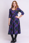 Women's purple plaid 3/4 sleeve long dress with round neckline and fitted bodice.