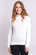 Women's cozy, white long sleeve turtleneck sweater, made of natural bamboo cotton fibers.