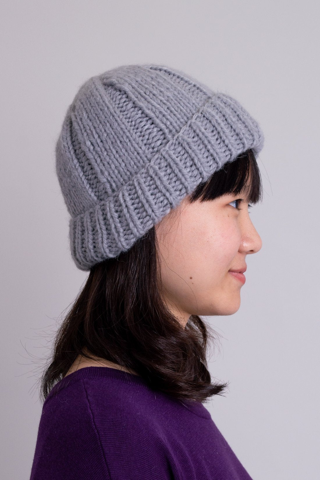 Women's grey knit toque wool beanie hat.