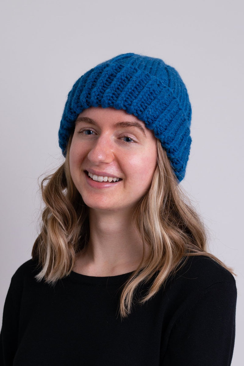 Women's teal blue toque wool beanie hat.