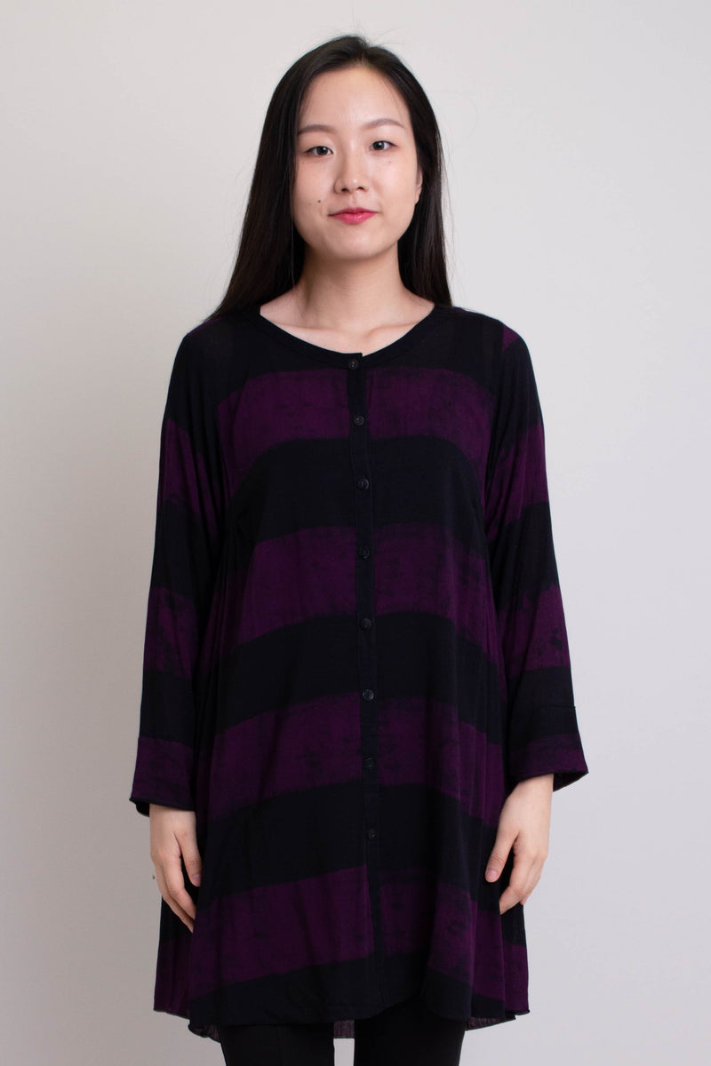 Women's long purple batik art long-sleeve shirt tunic with buttons, pockets, and wide open neckline.